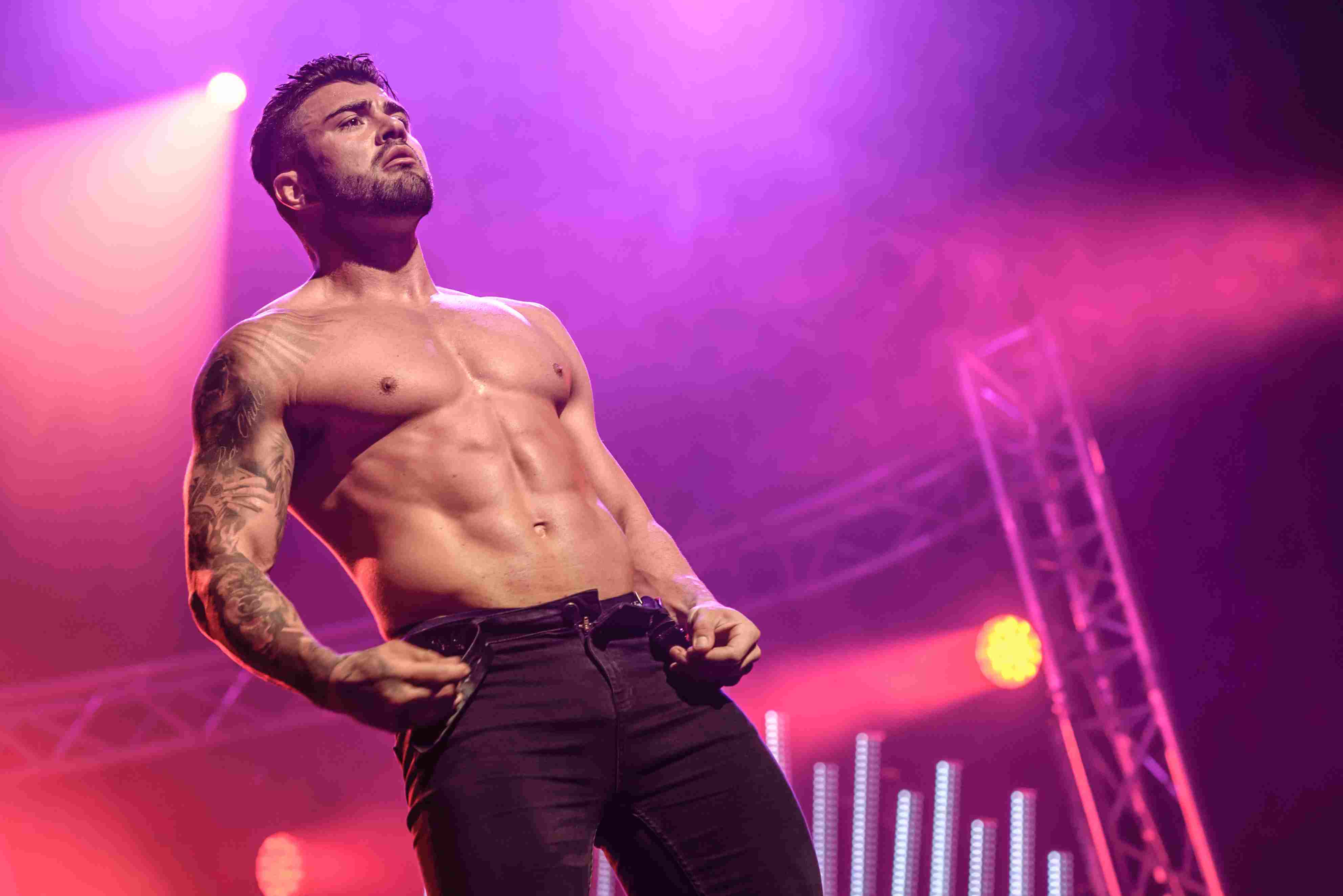 brandon bastian add male stripper on stage photo