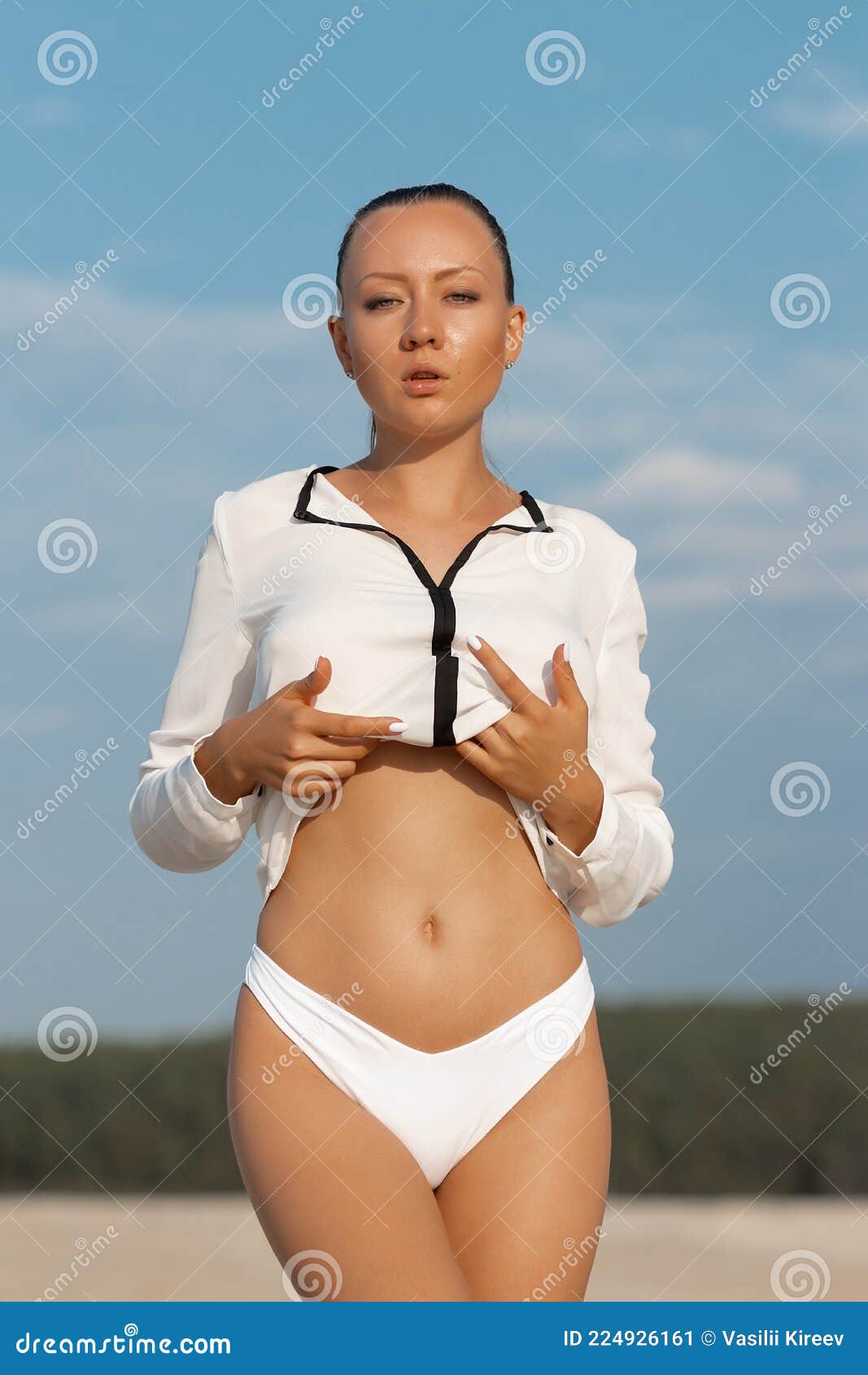 debra kinsey add photo taking off bikini top