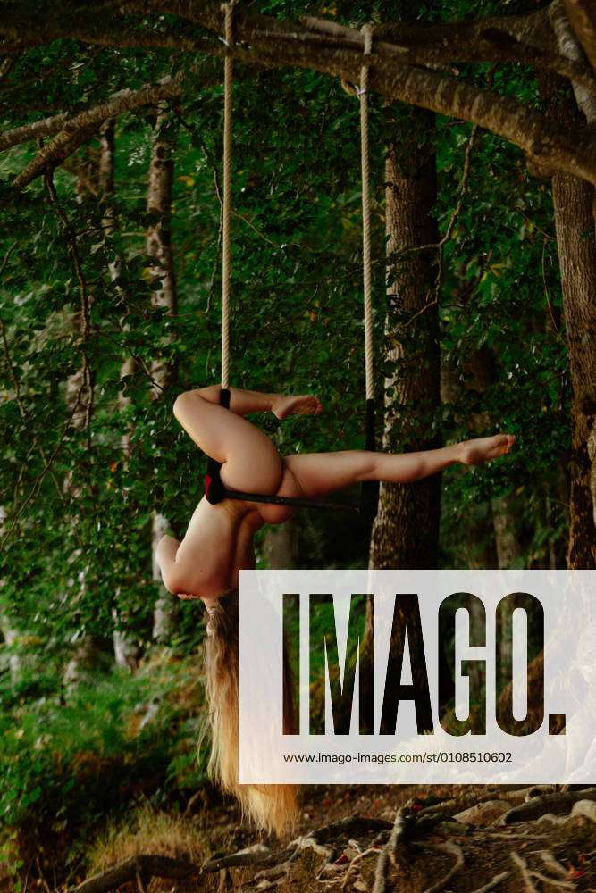 anne randell recommends nude women hanging upside down pic
