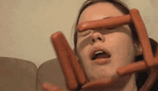 girl getting hit with hot dogs gif