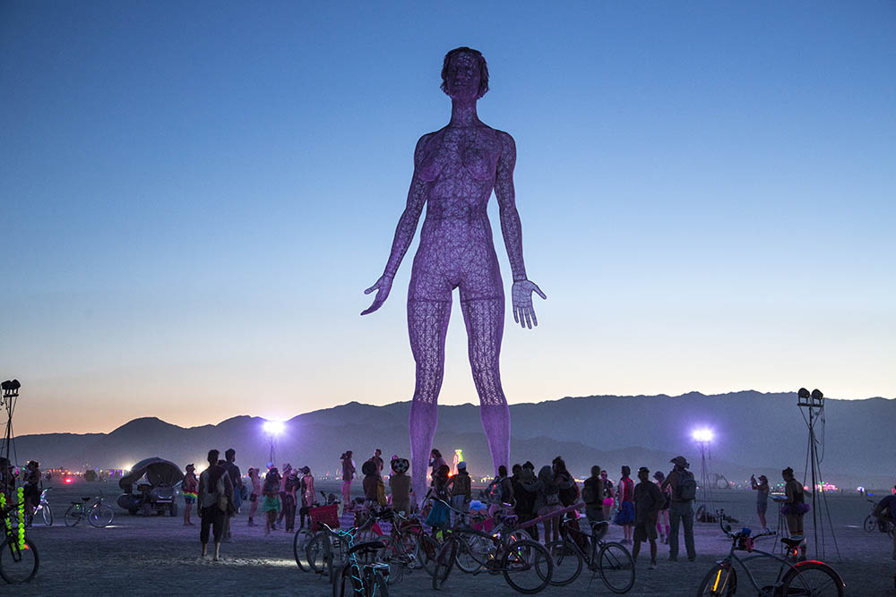 Naked Burning Man Women spot bedpost