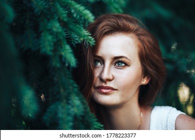 Redhead Woman With Green Eyes touching boobs